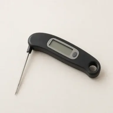 Instant-read digital meat thermometer with a metal probe and digital display